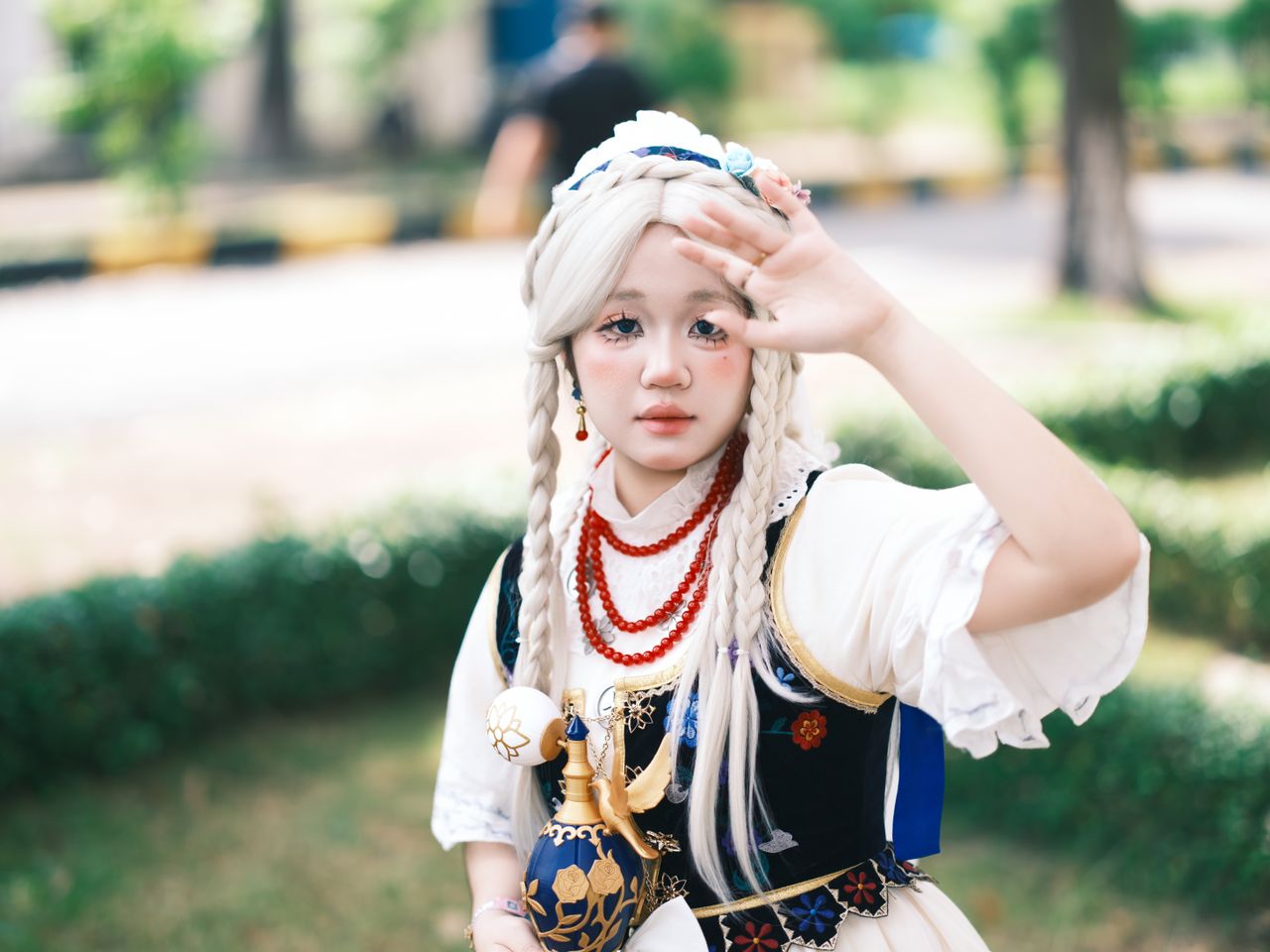 Crafting Captivating Headlines: Your awesome post title goes here A young adult in elaborate cosplay with braided hair and anime-inspired costume outdoors.